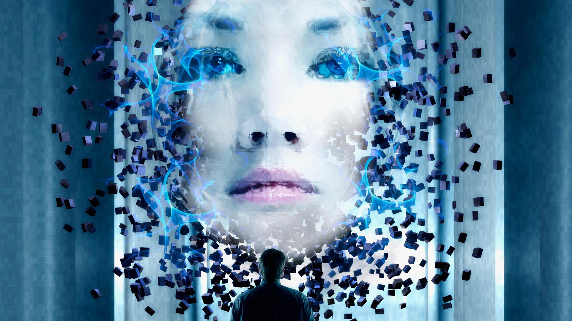 Ein Mann betrachtet das Hologramm des Gesichts einer jungen Frau.