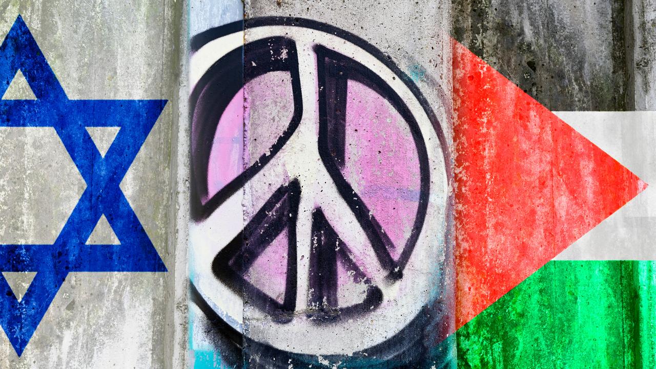 Auf einer Mauer sind Fahnen Israels und Palästinas zu sehen, in der Mitte zwischen beiden prangt ein Peace-Zeichen. 